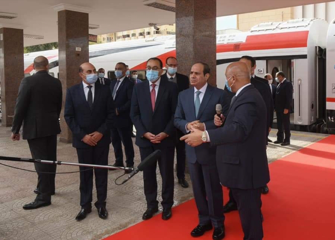 خلال افتتاح الرئيس اليوم عدد من المشروعات القوميه في صعيد مصر  وزير النقل يستعرض أمامه اصطفاف عدد من القطارات الجديدة والمجددة فى عدد من المحطات الرئيسية .